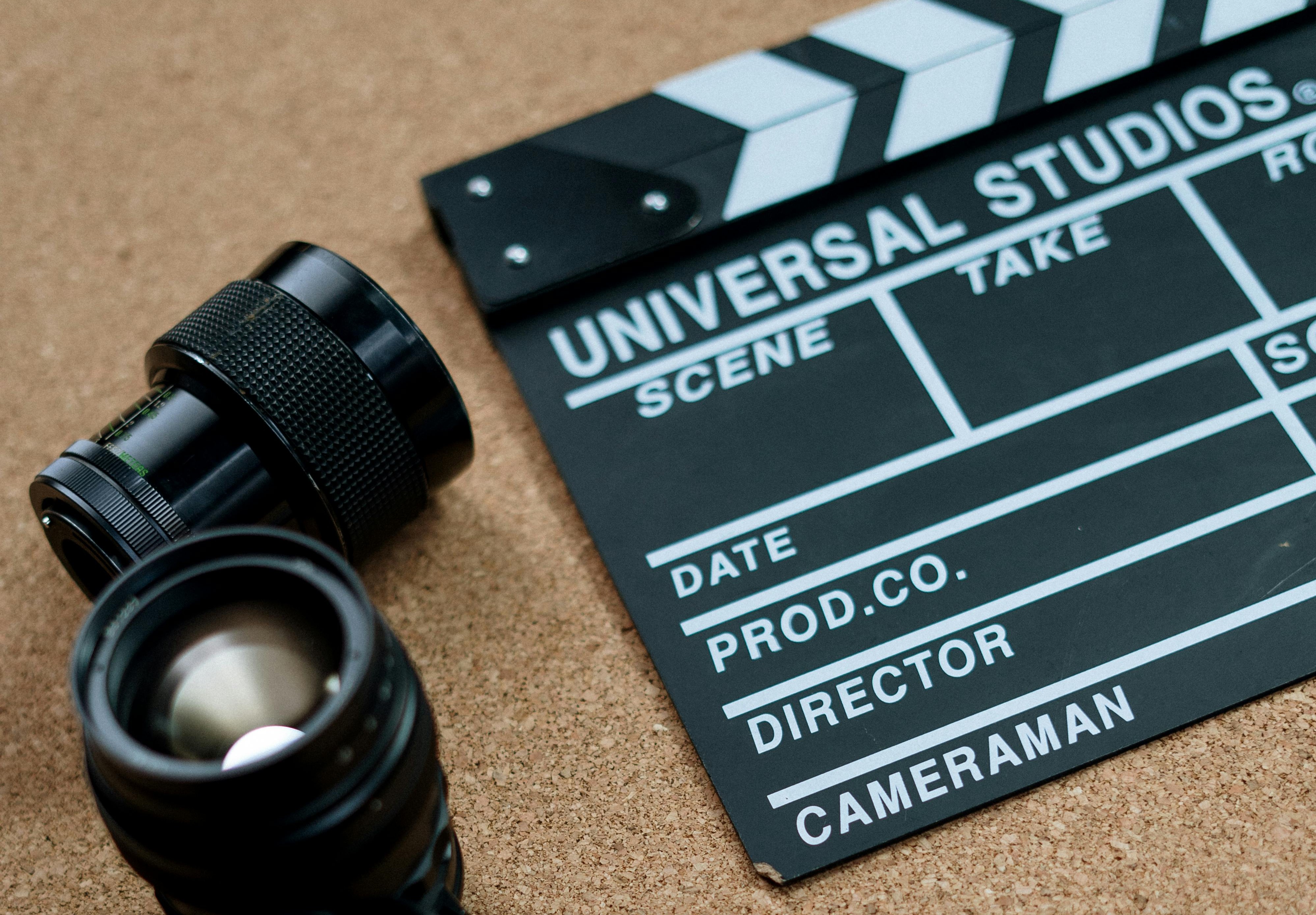 Camera lenses and a film clapperboard ready for recording