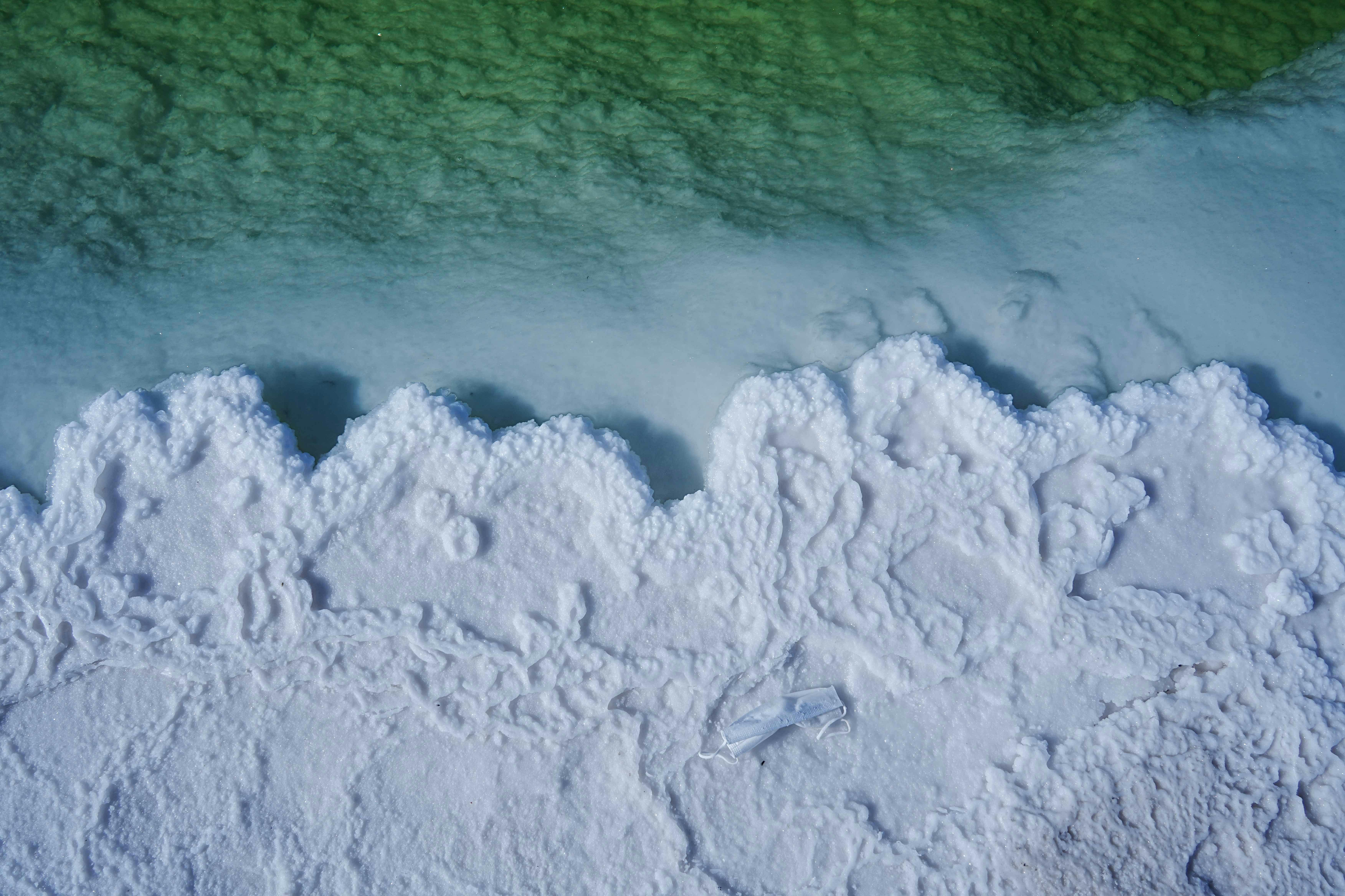 Aerial View of Salt Formation on Green Water
